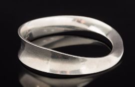 Georg Jensen. A 'Georg Jensen' wavy bangle: stamped 'Georg Jensen, 925S Denmark, 206 Torun M'.