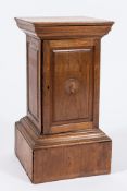 An Edwardian walnut square table top coin cabinet:, having sixteen interior fitted sliding trays,