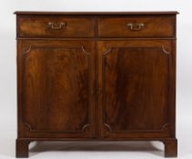 A late George III mahogany press cupboard:, the top with a moulded edge,