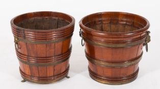 A 19th century teak and brass bound moulded bucket: with brass lions mask and ring handles 30.