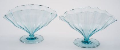 A pair of fan shaped glass vases by Harry Powell for Whitefriars: the pale blue body with wavy rim