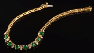 An 18ct gold, emerald and diamond bracelet: with seven,