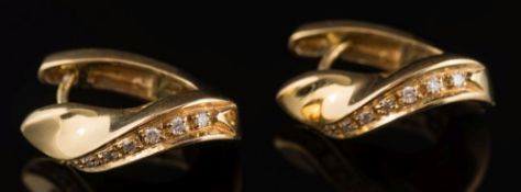 A pair of 18ct gold twist loop earrings: set with small graduated, brilliant-cut diamonds, 9.
