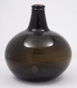 A Dutch magnum onion shaped wine or spirit bottle: the mid to dark green bottle with pontil mark