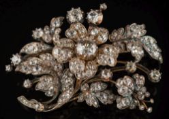 A mid 19th century diamond mounted spray brooch: the central diamond approximately 8.0mm wide x 3.