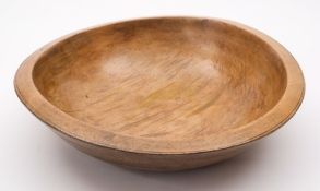 A large turned fruitwood bowl: with banded ring turned decoration, 43.5cm. diameter.