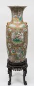 A massive Chinese Canton famille rose vase and hardwood stand: of ovoid form with flared rim and