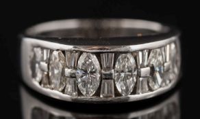 An '18K' white metal and diamond sixteen-stone diamond ring: with marquise-cut diamonds between