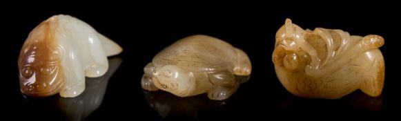 Three Chinese jade carvings and a snuff bottle: in the form of a tortoise,