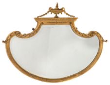 A giltwood and gesso framed mirror:, of cartouche-shaped outline,