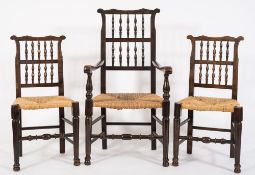 A set of seven early 19th Century ash and fruitwood spindle back dining chairs:,