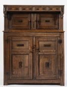 A 17th century oak court cupboard: with applied geometric bevelled mouldings,