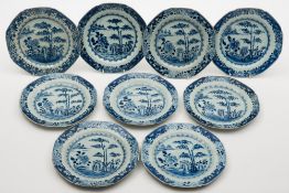 A set of nine Chinese blue and white octagonal plates: painted with a lake scene with bamboo trees,