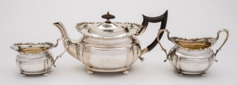 An Edward VII silver three-piece bachelor's tea set, maker Goldsmiths & Silversmiths Co Ltd, London,