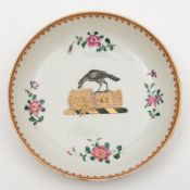 A Chinese famille rose armorial large saucer: painted en grisaille and gilt with the crest of