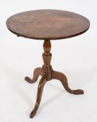 A late 18th century oak circular occasional table:, the snap top on turned baluster,