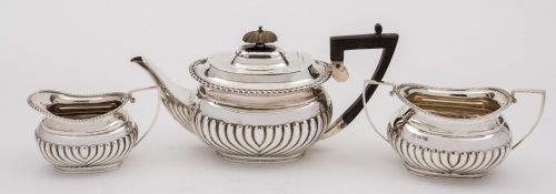 A Victorian matched three-piece silver bachelor's tea service,