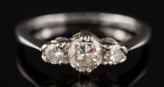 An 18ct white gold, platinum and diamond three stone ring: with central,
