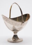 A Victorian silver swing handled sugar basket, maker Walter & John Barnard, London, 1879: crested,
