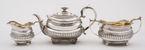 A George III silver matched three-piece tea service.
