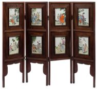 A Chinese 'Eight Immortals' famille rose four-fold screen: each panel painted with an immortal and