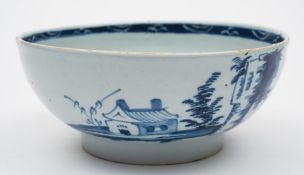 An English blue and white delftware bowl: painted with a house and fence in a landscape vignette,