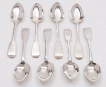 Eight Irish silver Fiddle pattern dessert spoons, various makers and dates: all crested,9.53ozs.