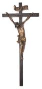 A 17th/18th century gilt and polychrome Tyrolean crucifix: the corpus with traces of paint on a