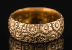 A 19th century gold floral design band:, 7gms gross weight, ring size L 1/2.