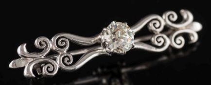 A diamond mounted single-stone scroll design bar brooch: together with a copy of a corresponding