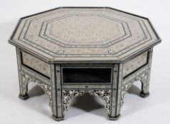 A Near Eastern ebonised and ivory and mother of pearl inlaid octagonal centre table:,