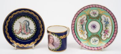 A Sèvres-style 'jewelled' cabinet cup and saucer together with a similar saucer: the first painted