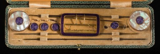 An Edwardian gilt-metal and purple enamel dressing set: comprising hat pins with two circular