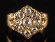 A mid 19th century gold and diamond nine-stone cluster ring: with cushion shaped old-cut diamonds,