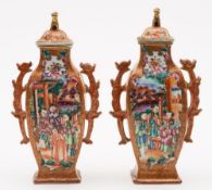 A pair of Chinese 'Mandarin' pattern vases and covers: of flattened baluster form with dragon