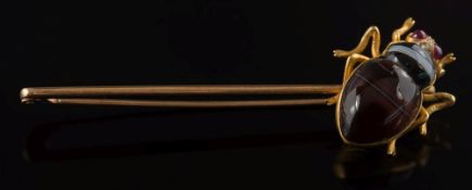 A banded agate, ruby and diamond mounted 'beetle' stick pin: 24mm length of beetle,