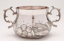 A Charles II silver porringer,