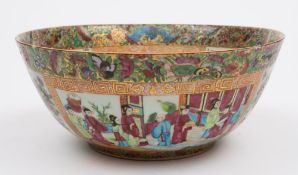 A Canton famille rose bowl: the interior and exterior painted with panels of figures on garden