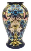 A large Moorcroft pottery vase: of baluster form tubelined in the Profusion pattern after the
