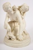A Gustavsberg parian figure group: modelled as a scantily draped mother and child at play,