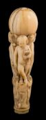 A late 18th century Continental ivory walking cane handle: the circular pommel supported by three