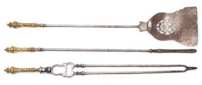 A set of three 19th century steel and brass fire implements: the brass handles with knopped and