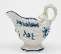 A Worcester blue and white 'dolphin' creamboat: with lamprey handle,
