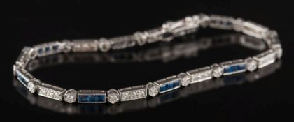 An 18ct white gold, sapphire and diamond line bracelet: mille-grain set with circular,