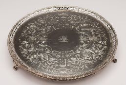 A George III silver salver, maker Charles Hollinshed, London, 1809: crested, of circular outline,