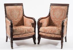 A pair of French 'Restauration' mahogany fauteuils:,
