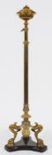 A Victorian brass standard oil lamp:, the reeded adjustable column with circular font,
