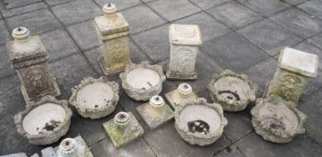 A set of six 'stone' garden urns:,