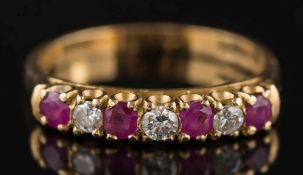 An 18ct gold, ruby and diamond seven-stone half hoop ring: with circular,