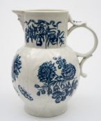 A large First Period Worcester blue and white cabbage leaf jug: with mask head spout,